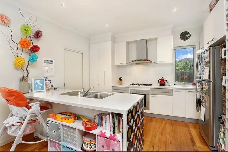 Same kitchen after AI decluttering with countertop clutter removed before